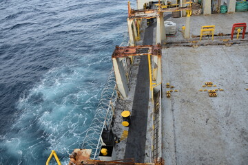 Stainless steel sharp razor wire or barbed wire attached to the ship hull, superstructure and...