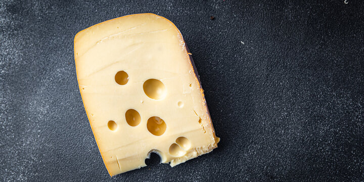 cheese holes hard aged maasdam, radamer, masdamer fresh dietary healthy meal food diet snack on the table copy space food background rustic top view