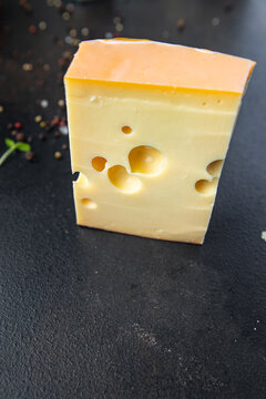 cheese holes hard aged maasdam, radamer, masdamer fresh dietary healthy meal food diet snack on the table copy space food background rustic top view