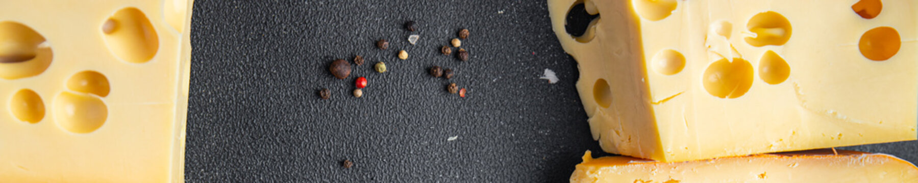 cheese holes hard aged maasdam, radamer, masdamer fresh dietary healthy meal food diet snack on the table copy space food background rustic top view