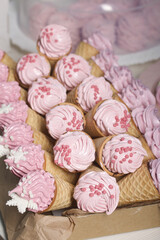 Zephyr in waffle cones. Decorated with decorative sprinkles and mastic snowflakes.