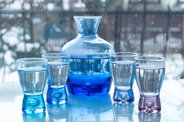 glass of water on blue background