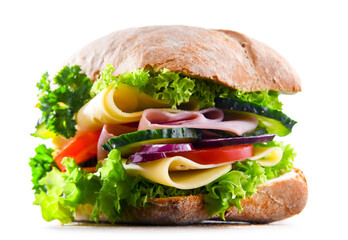 Sandwich with cheese and ham and fresh vegetables over white
