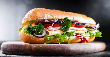 Sandwich with cheese and ham and fresh vegetables