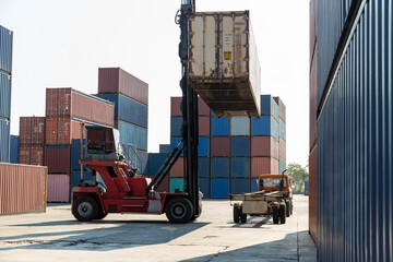 Crane lifting up container in railroad yard. Crane lifting up container in yard. forklift handling...