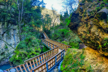 crystal clear stream running through a pristine valley in the town of Pioraco in the Marche region,...
