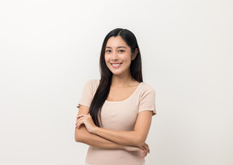 Obraz premium Beautiful young asian woman age around 25 smiling and happy. Charming female standing on isolated white background. Asian people pose looking camera with white backdrop.
