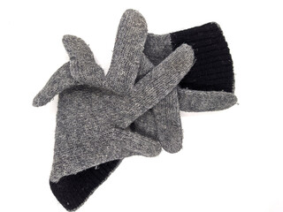 pair of two warm woolen knitted gloves isolated on white background.