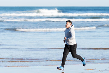 Hispanic young man running