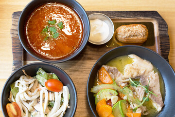 A full lunch the restaurant borscht salad sweet cake served wooden board.