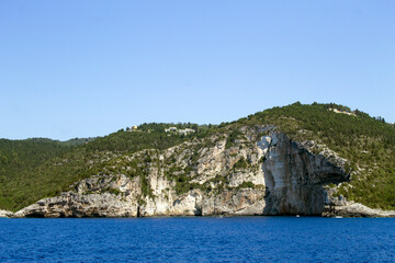 BEAUTIFUL BLUE SEA WILD ROCKS AND BEAUTIFUL CAVES ON THE ISLANDS OF THE IONIAN SEA, PAXOS, AND ANTIPAXOS IN  - 482166239
