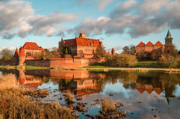 Naklejka na ściany i meble Malbork castle in Pomerania region of Poland. UNESCO World Heritage Site. Teutonic Knights' fortress also known as Marienburg. Nogat river