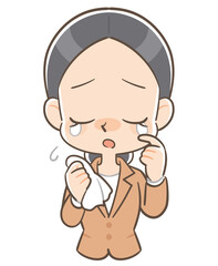 悲しい様相で涙ぐむスーツ姿の女性