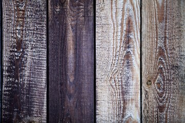 Dark wood boards texture close up. Vintage wooden surface background. Unpainted natural hardwood boards texture. Weathered surface of the old planks of wooden wall close-up. High contrast wood.