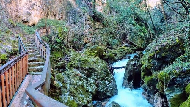 crystal clear stream running through a pristine valley in the town of Pioraco in the Marche region, Italy