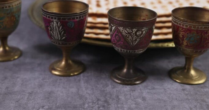 Orthodox Jewish prepared with four cup wine kosher matzah on traditional jewish passover holiday PASSOVER