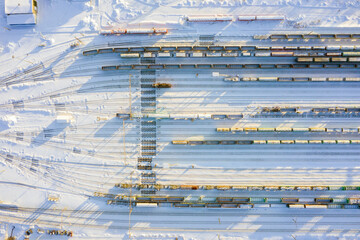 Branches of the railway at the marshalling yard, a lot of freight wagons from the height.
