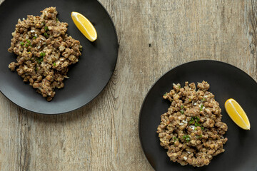 Lentil salad portion plate top view. Ethiopian cuisine. Azifa dish with senafich homemade mustard.