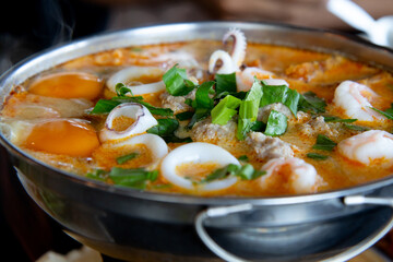 Tom Yum prawn and Squid in Thai Style,spicy prawn soup in the hot pot