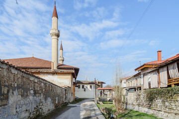 Fototapeta na wymiar View of Big Mosque and North gate of Khan's Palace from River Street. Bakhchysarai. Crimea