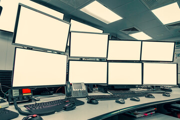 group of blank monitors and screen on security desk or control room for monitor process or stock data trading