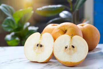 Snow pear or Fengsui pear on the  table in garden,Fresh Korea pear fruit. Korea pear fresh fruit on the plate. 