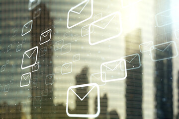 Double exposure of abstract virtual postal envelopes hologram on modern skyscrapers background. Electronic mail and spam concept