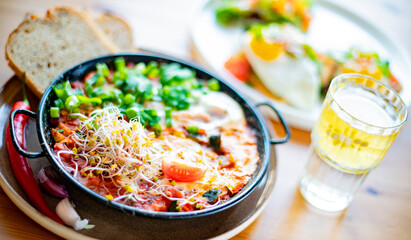 Egg shakshouka dish on a restaurant table