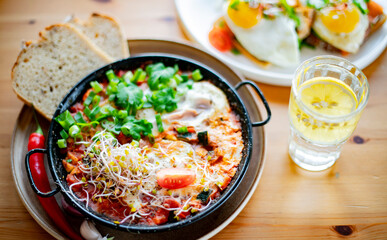 Egg shakshouka dish on a restaurant table