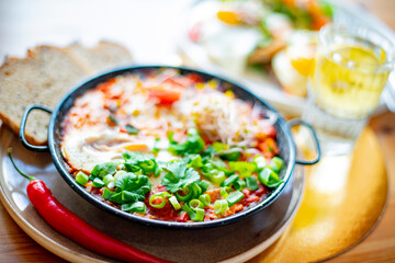 Egg shakshouka dish on a restaurant table