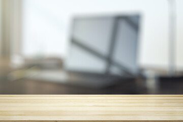 Fototapeta na wymiar Empty office wooden table with empty space on modern workplace with computer background, close up, mockup