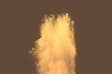 Abstract multicolored powder splatted on brown background, Freeze motion of color powder exploding....