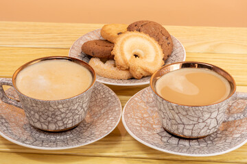 cups of latte and cookies