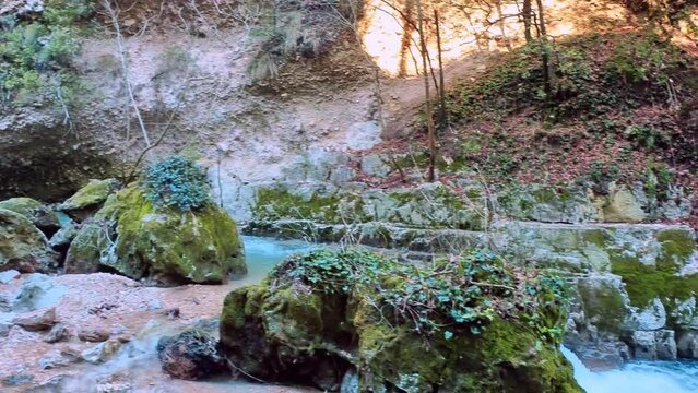 crystal clear stream running through a pristine valley in the town of Pioraco in the Marche region, Italy