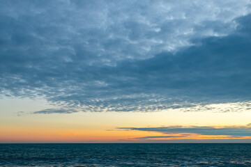 Naklejka na ściany i meble seascape with evening sky and clouds