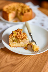 Piece of apple or pear pie, tart with caramel nuts on wooden table, copy space, top view.