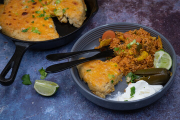 Vegetarian Mexican rice, skillet corn cake, cream, pickles