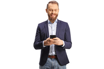 Portrait of a young man in suit and jeans typing on a mobile phone