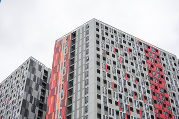 Fototapeta premium High-rise hotel or apartment buildings are a residential solution for people who live and work in big cities that are very densely populated and land is very expensive.