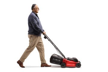 Full length profile shot of a mature man using a lawnmower - obrazy, fototapety, plakaty