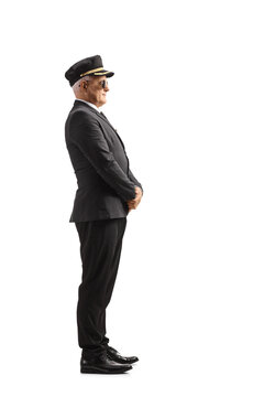 Full Length Profile Shot Of A Chauffeur In A Uniform Standing