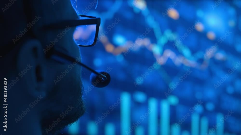 Poster trader is working with multiple computer screens with charts and data analysis and stock broker trad