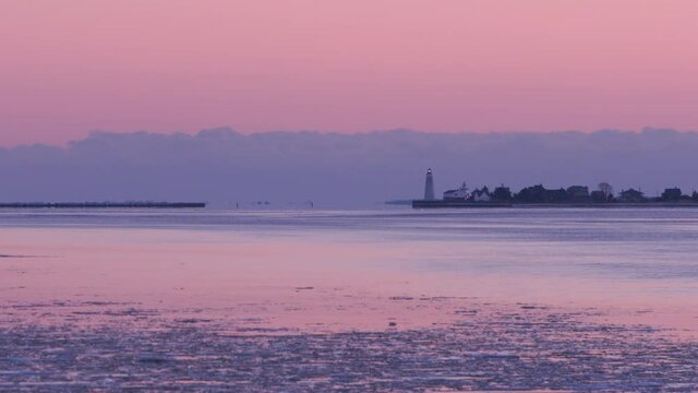Lighthouses at the mouth of the Connecticut River in winter with Ice actively flowing downstream