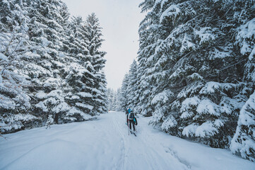 Mountaineer backcountry ski walking ski alpinist in the mountains. Ski touring in alpine landscape...