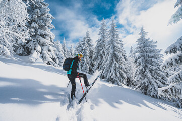 Mountaineer backcountry ski walking ski alpinist in the mountains. Ski touring in alpine landscape...