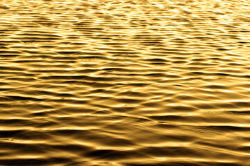 Water ripples reflection background.  Ripping water with sunlight reflection background.
