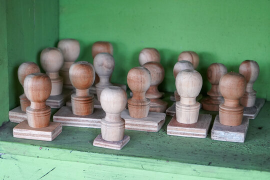 A collection of stamps made of brown wood.