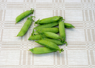 A pile of pea pods laying on a table