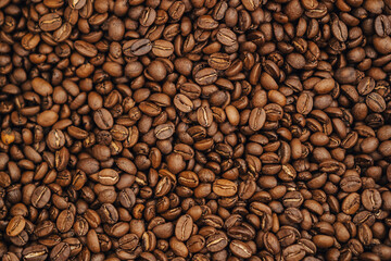 Top view of roasted coffee beans. Freshly roasted coffee, background image.