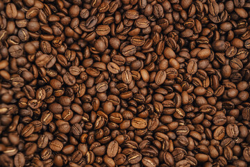 The process of roasting coffee beans. Coffee beans being roasted in a roasting machine. 